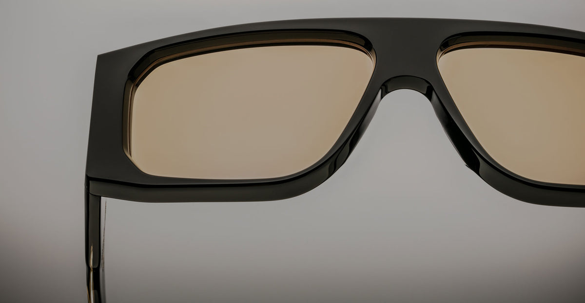 Close-up view of Jacques Marie Mage Cliff sunglasses featuring polarized light brown lenses, showing the front angle.