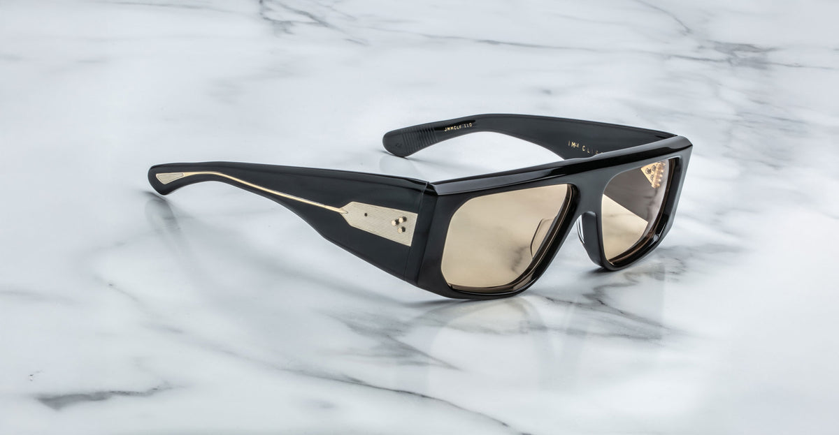Jacques Marie Mage Cliff sunglasses with tinted lenses shown from above.