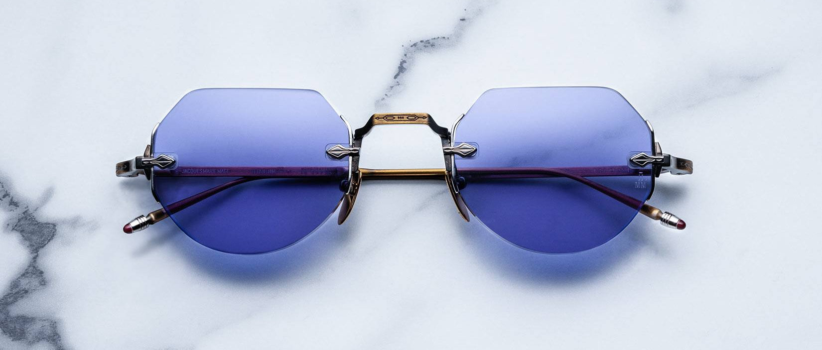 Jacques Marie Mage Cody style rimless sunglasses in Bronze colorway with purple lenses