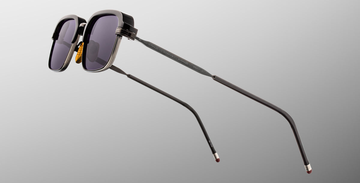 Jacques Marie Mage Comanche in Corbeau rectangular black sunglasses with UV-protection lenses and thin metal arms, side view.