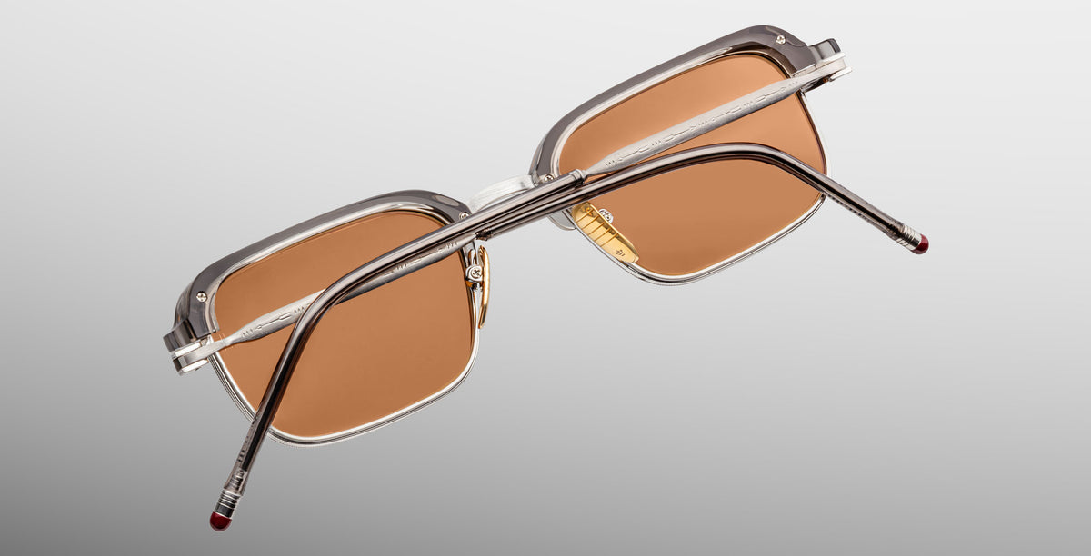 Jacques Marie Mage Comanche in Vintage Tortoise rectangular sunglasses with brown lenses, clear acetate rims, and metal bridge shown from a rear angled view.
