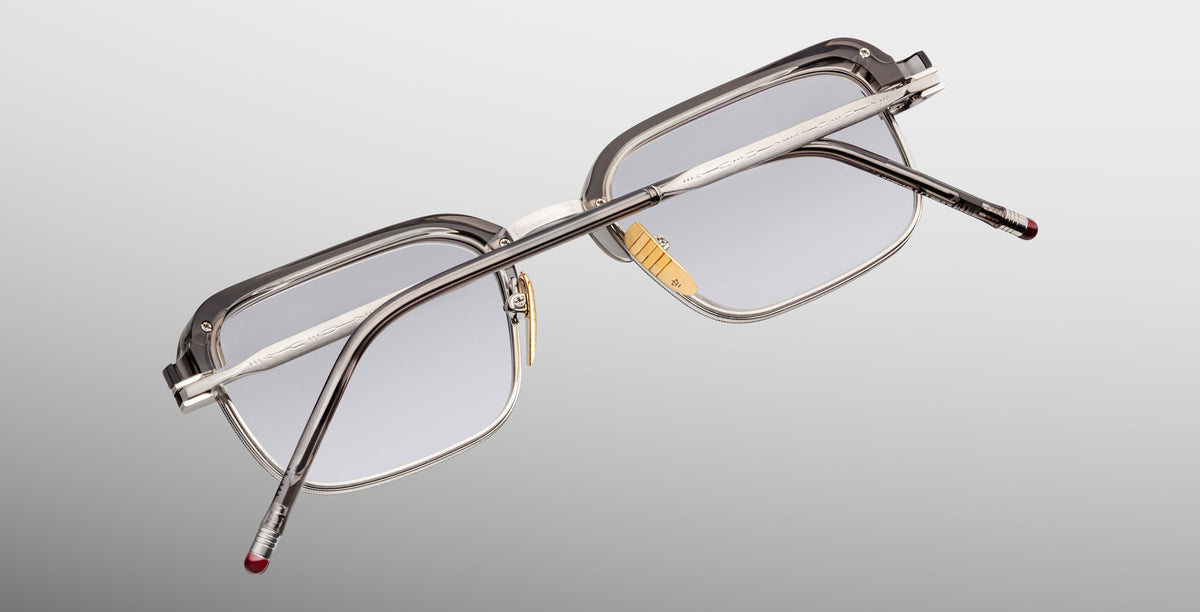 Jacques Marie Mage Comanche in Tempest rectangular eyeglasses with clear frames and silver arms, viewed from the back.
