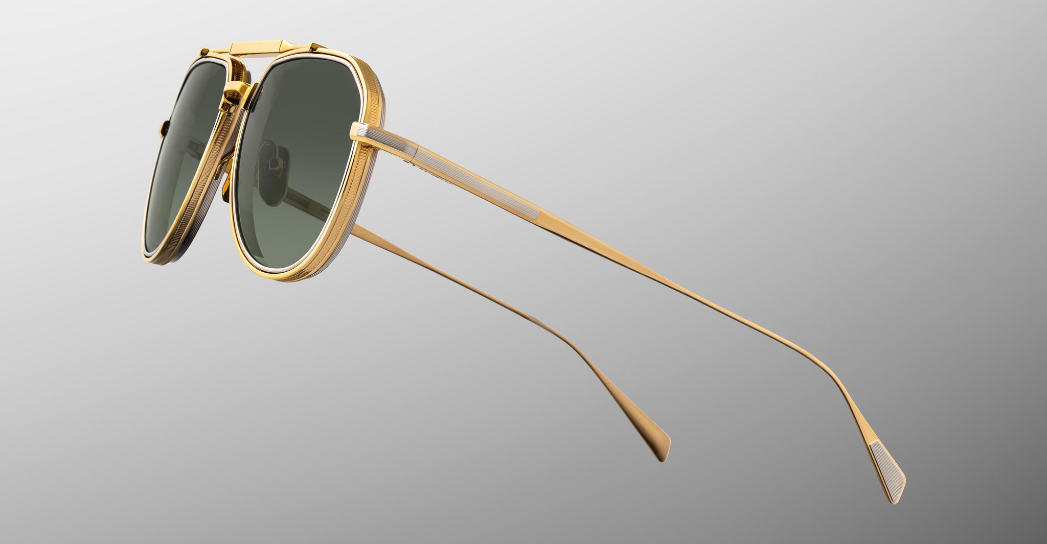 Angled side view of Jacques Marie Mage Commander in Musket, highlighting the gold-tone titanium frame, engraved lens rims, adjustable nose pads, and slender temples with sculpted tips.