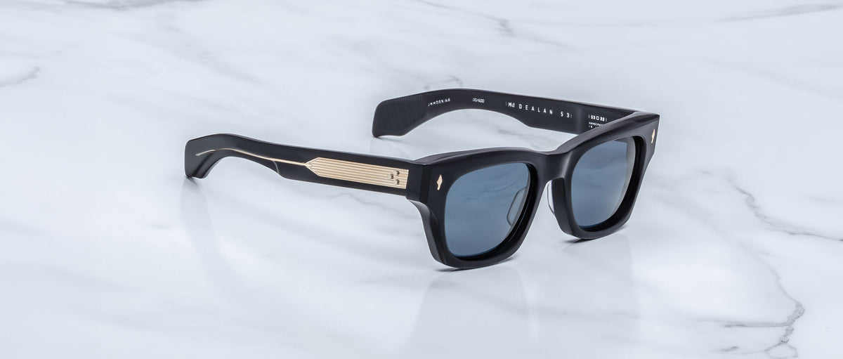 Jacques Marie Mage Dealan 53 black polarized sunglasses with gold temples, top view.