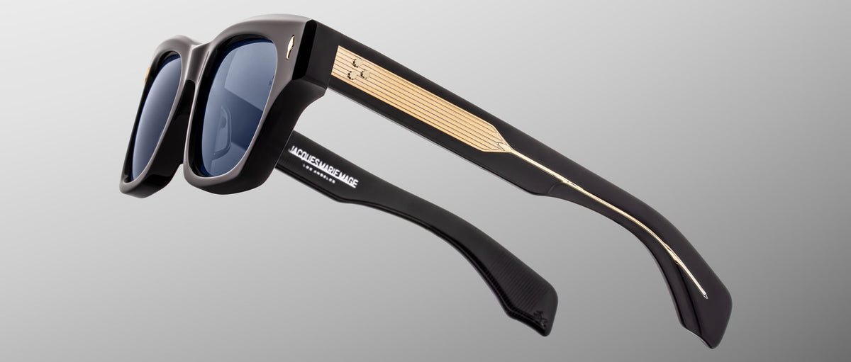 Jacques Marie Mage Dealan 53 black sunglasses with gold temple accents, front angle view.
