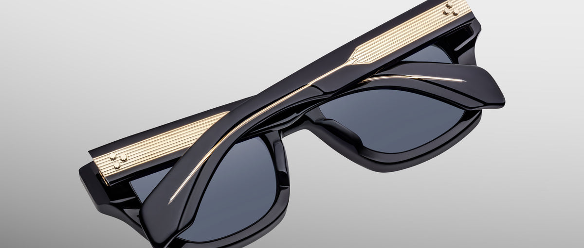Jacques Marie Mage Dealan 53 sunglasses with gold accents, folded, viewed from above.