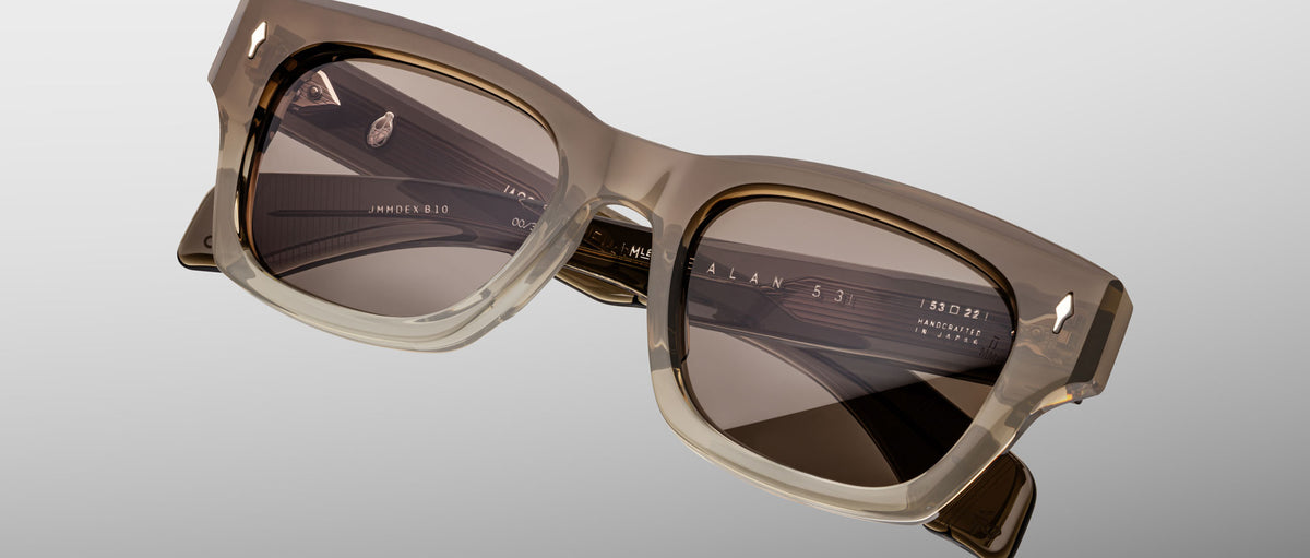 Jacques Marie Mage Dealan 53 sunglasses with square beige frames and dark lenses, shown from the front.