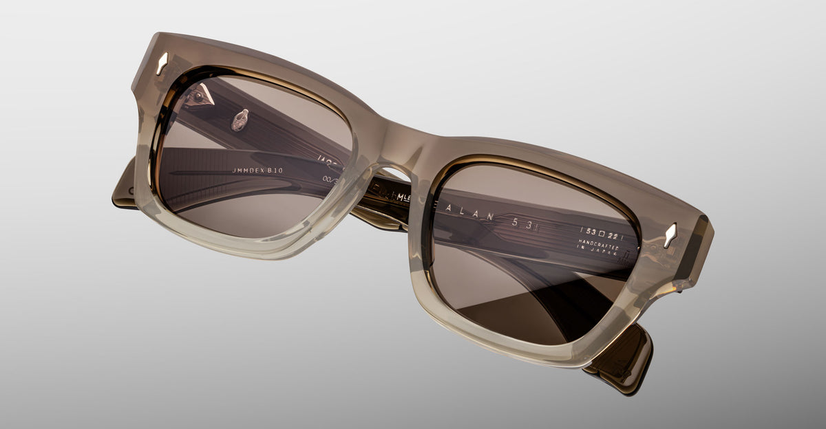 Jacques Marie Mage Dealan 53 sunglasses with square beige frames and dark lenses, shown from the front.