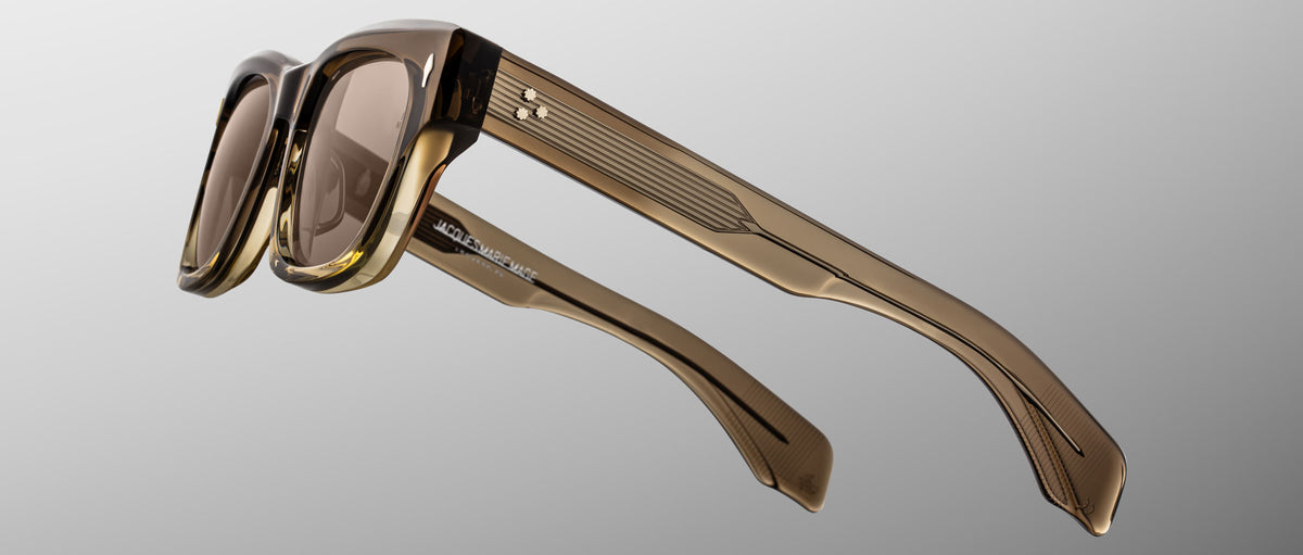 Jacques Marie Mage Dealan 53 sunglasses shown front view, brown translucent thick angular retro-style frame.