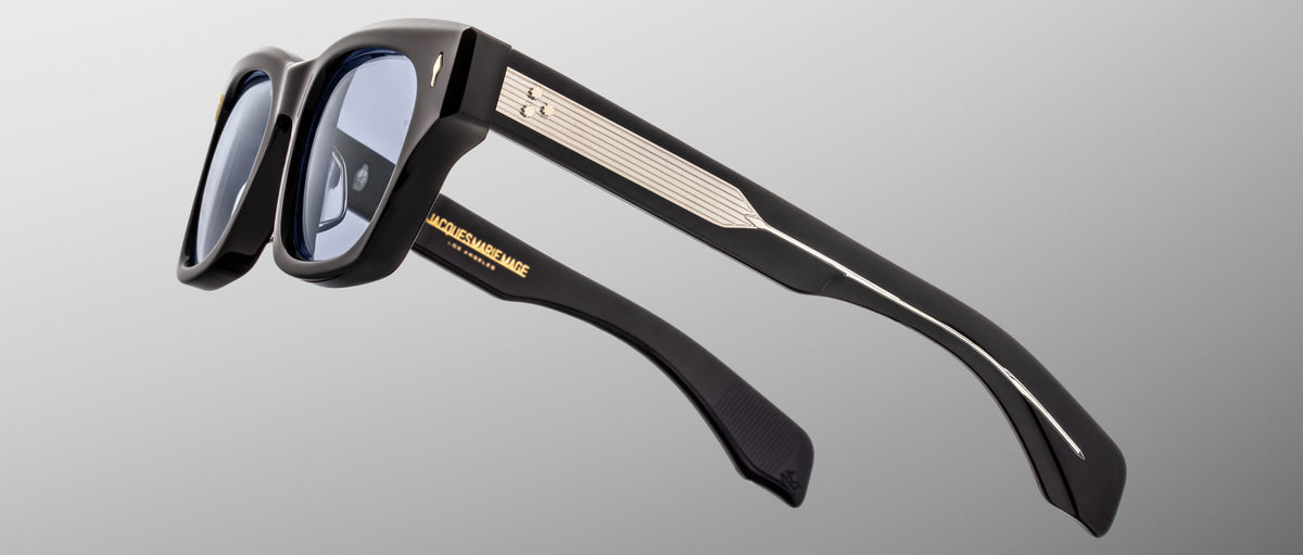 Jacques Marie Mage Dealan 53 black smart eyeglasses with thick frames, metallic accents, and left-lens camera, front view.