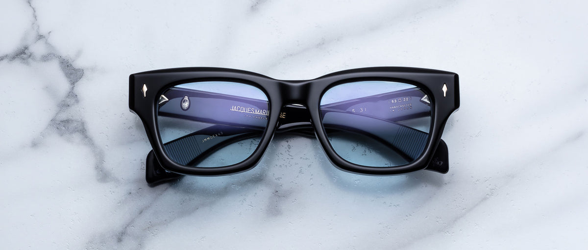 Jacques Marie Mage Dealan 53 black rectangular eyeglasses with clear lenses, top-down view.