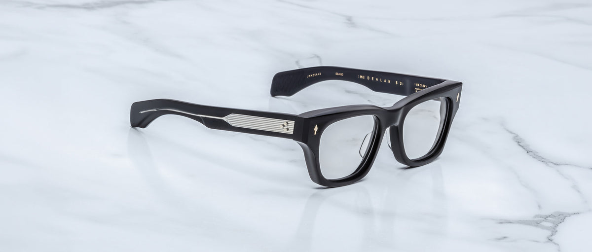 Jacques Marie Mage Dealan 53 eyeglasses, black thick rectangular frames with silver temples, shown from above.