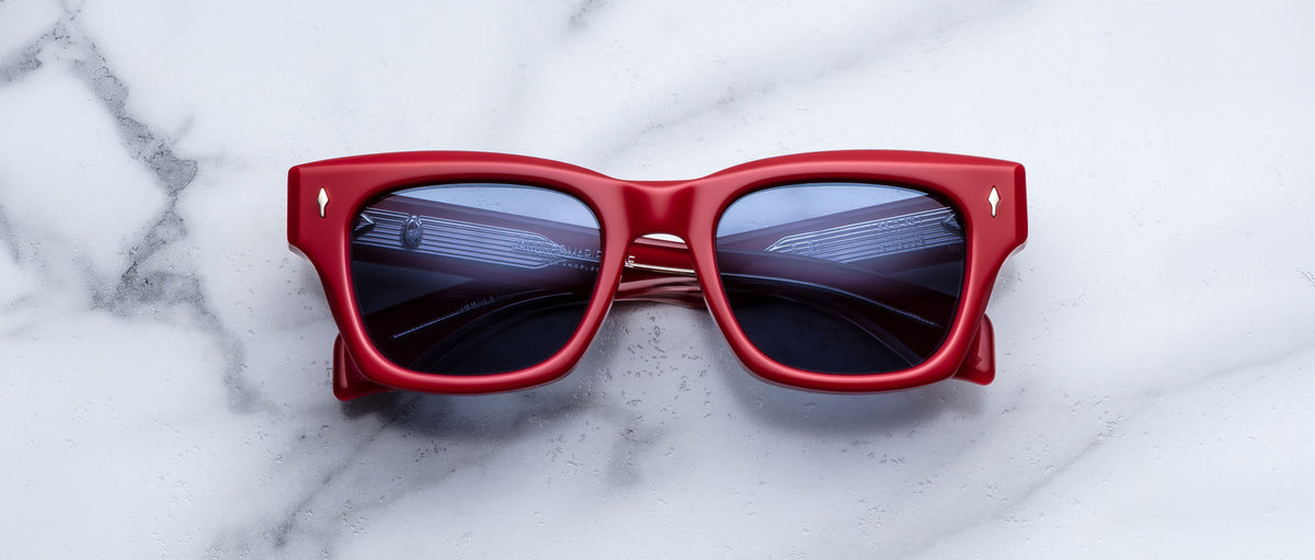 Jacques Marie Mage Dealan 53 red sunglasses with UV-protected dark lenses, top view.