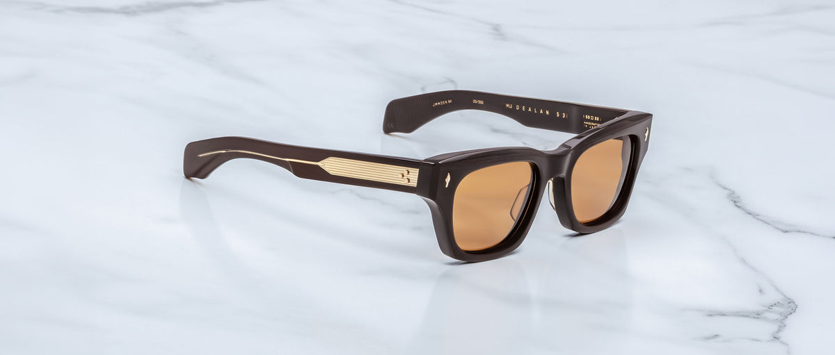 Jacques Marie Mage Dealan 53 sunglasses with gold temple accents, shown from above highlighting gold details.