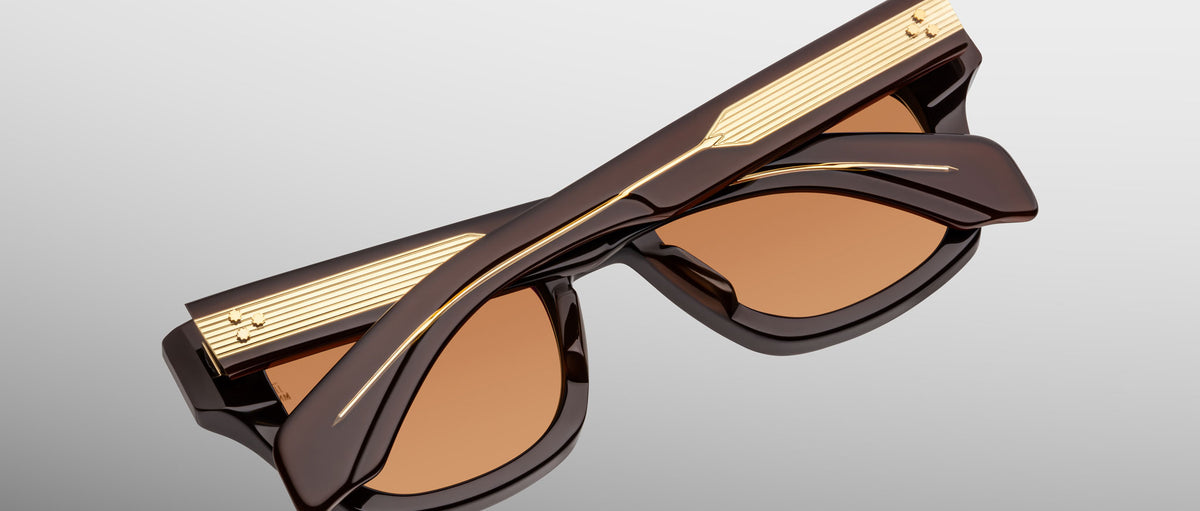 Jacques Marie Mage Dealan 53 brown sunglasses with gold-detailed arms, top view.