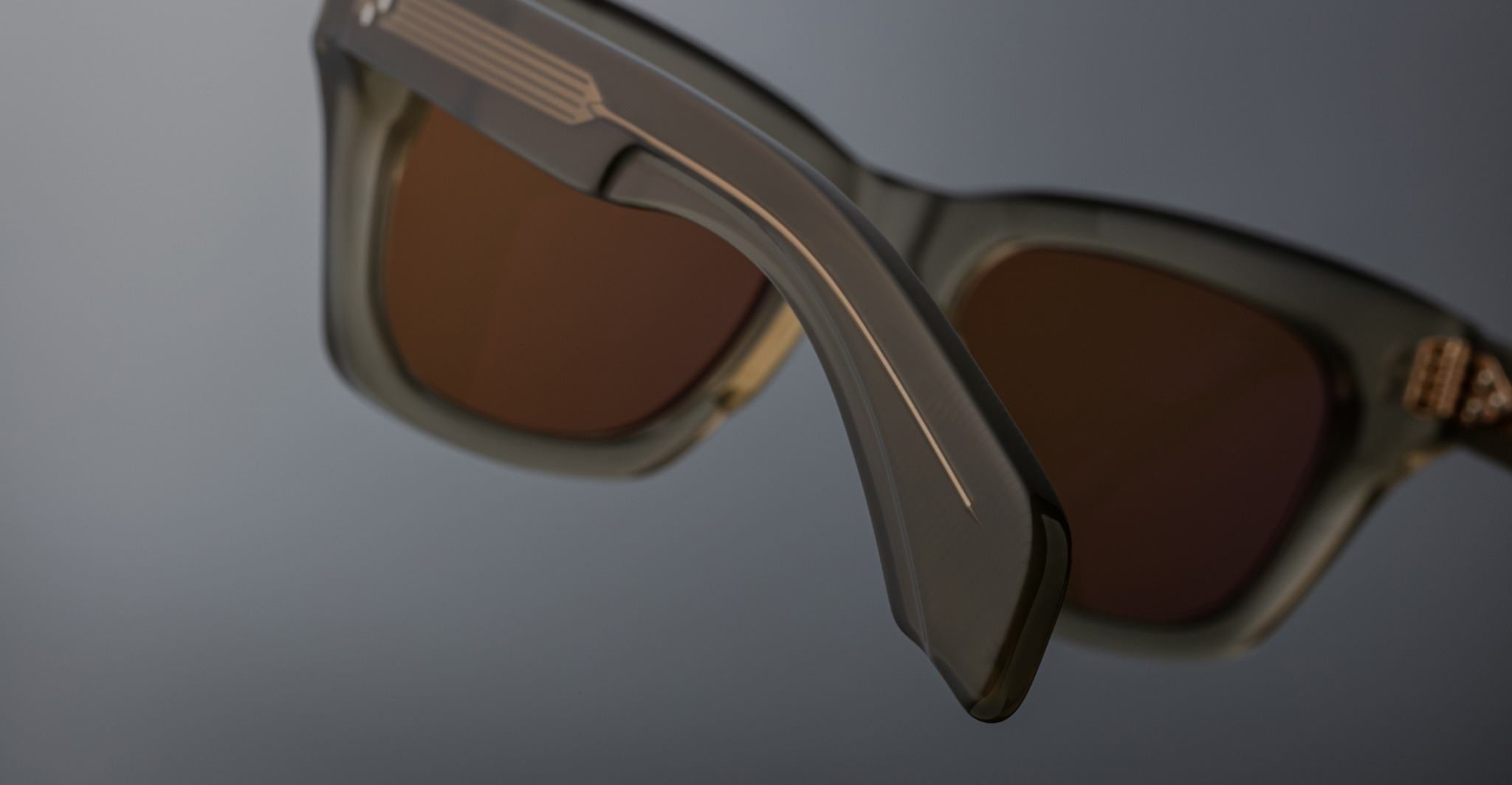 Jacques Marie Mage Dealan sunglasses, close-up view, featuring brown lenses and matte gray frames.