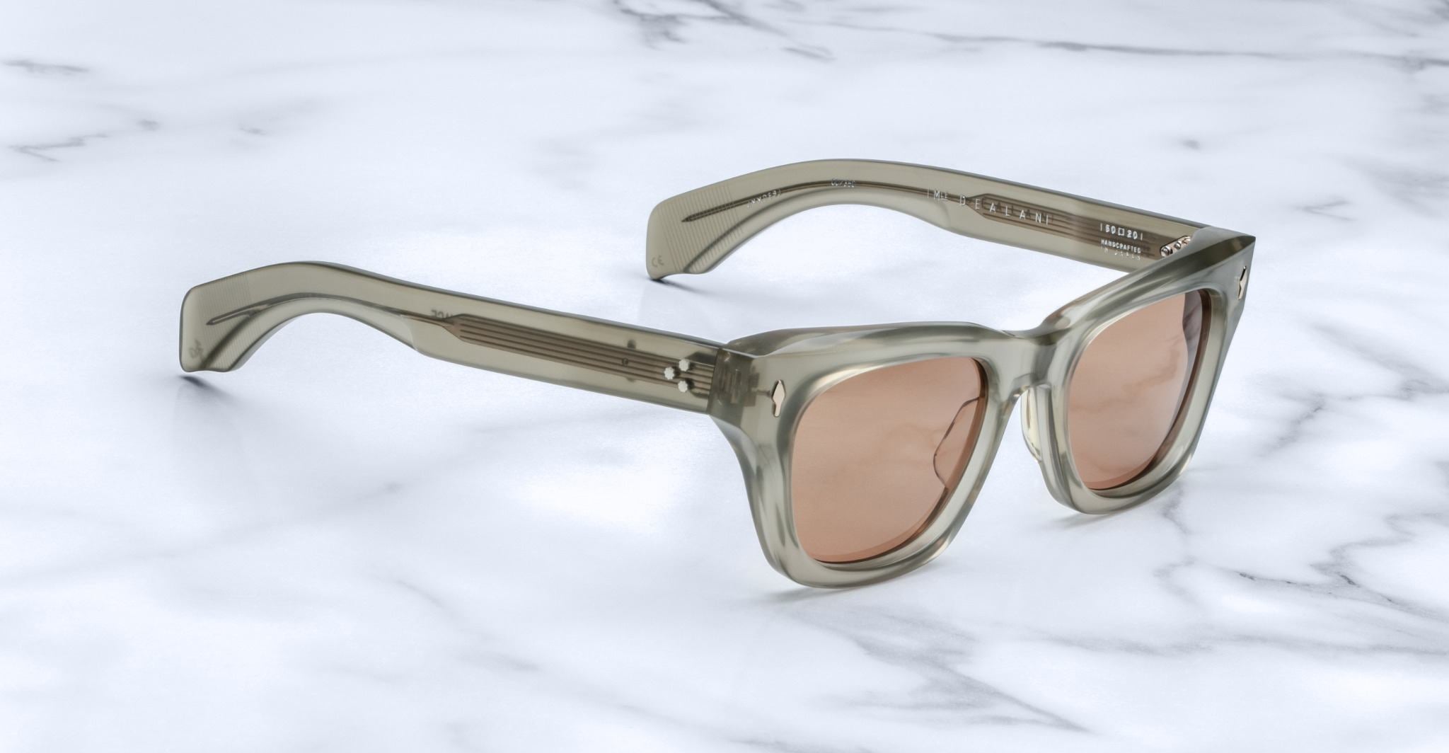 Jacques Marie Mage Dealan rectangular gray sunglasses with brown lenses, top view.