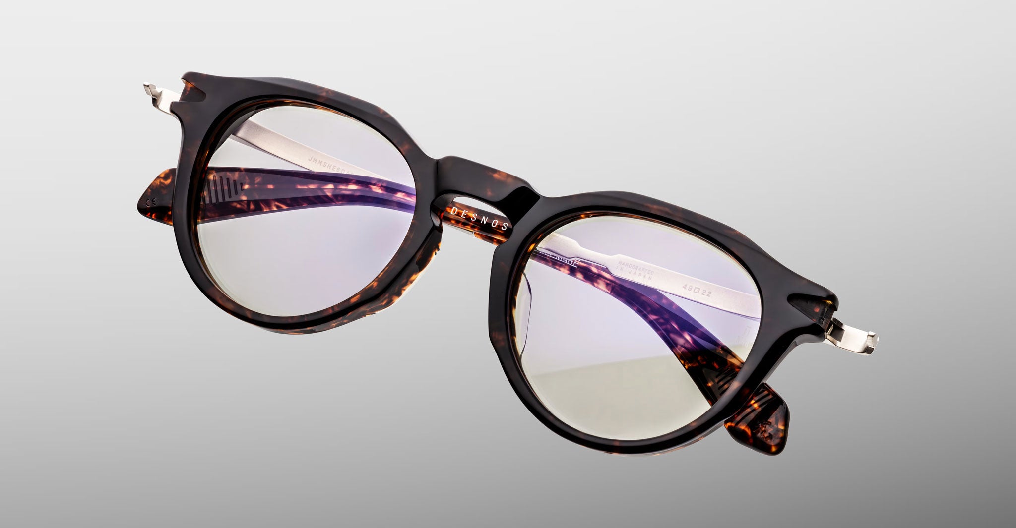 Jacques Marie Mage Desnos round tortoiseshell eyeglasses with clear lenses and silver hinges, front view.