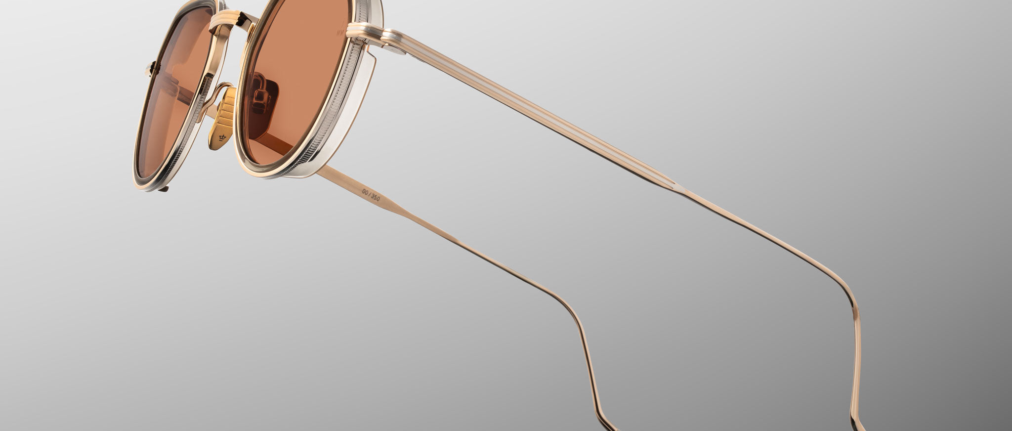 Jacques Marie Mage Dixon gold metal sunglasses with brown lenses, double bridge, and slim temples, front view.