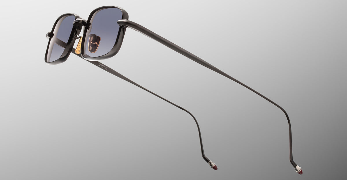 Jacques Marie Mage Dusk sunglasses, black square frame, thin arms, gray gradient lenses, front angle view.