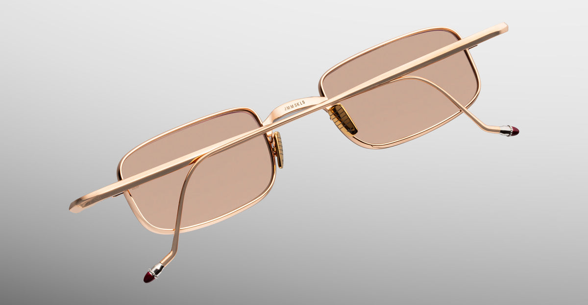 Jacques Marie Mage Dusk sunglasses with rectangular gold frames and brown lenses, back view.