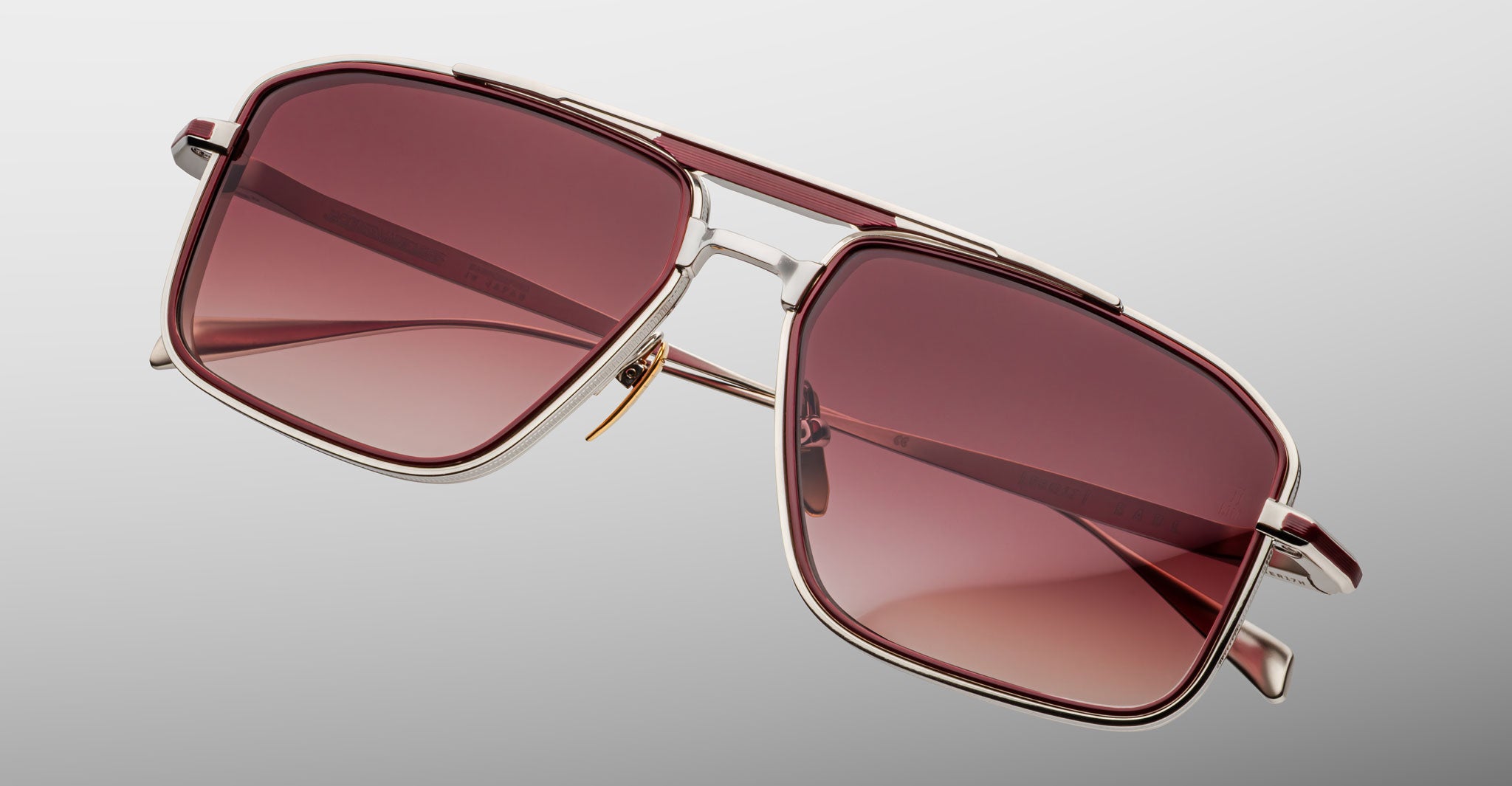 Jacques Marie Mage Earl rectangular sunglasses with silver frames and red lenses, shown from the front.