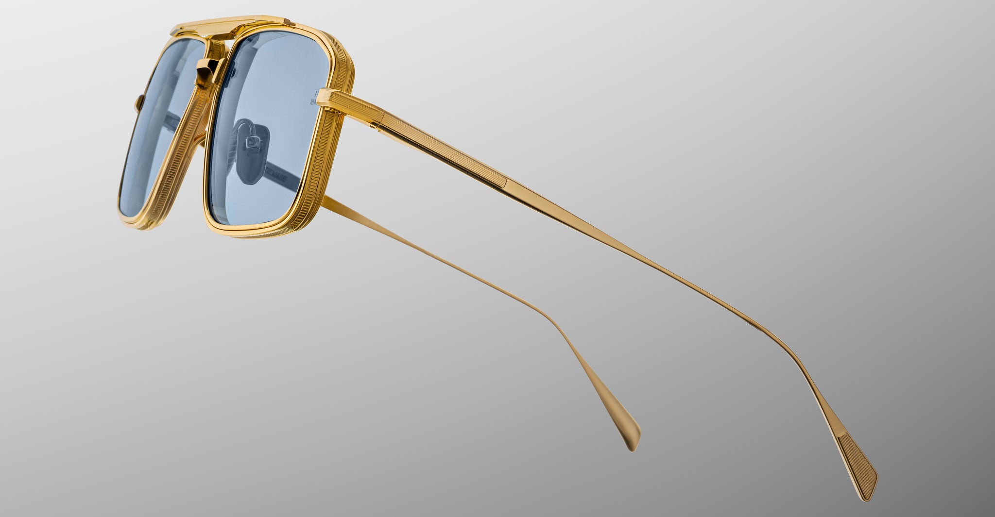 Jacques Marie Mage Earl aviator sunglasses with gold frames and blue-tinted lenses, front view.