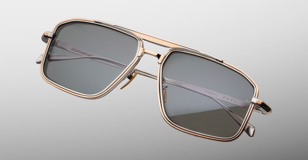 Jacques Marie Mage Earl gold rectangular sunglasses with dark lenses, front view.
