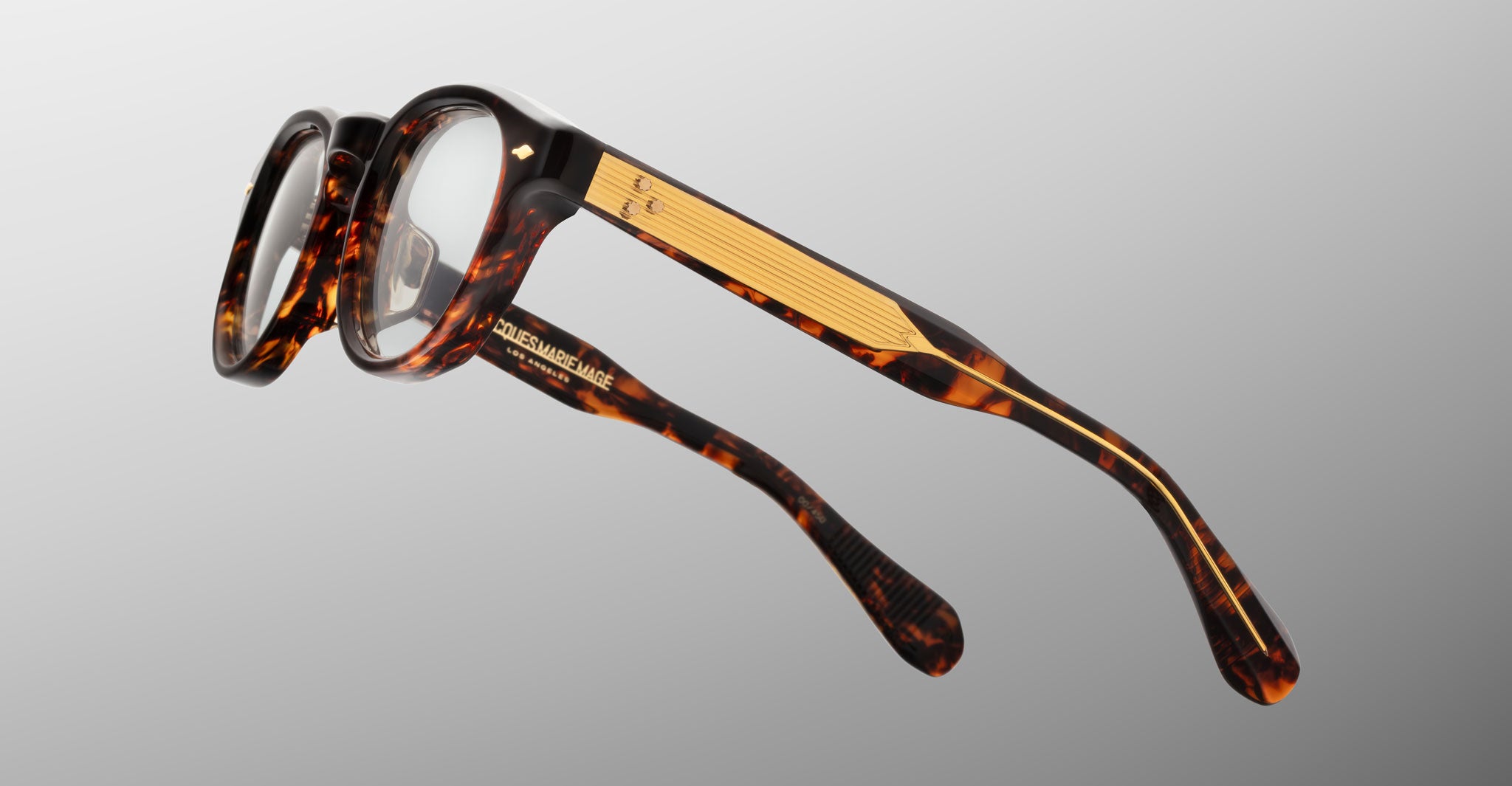 Jacques Marie Mage Eiko eyeglasses, gold-detailed arms, side angle view.