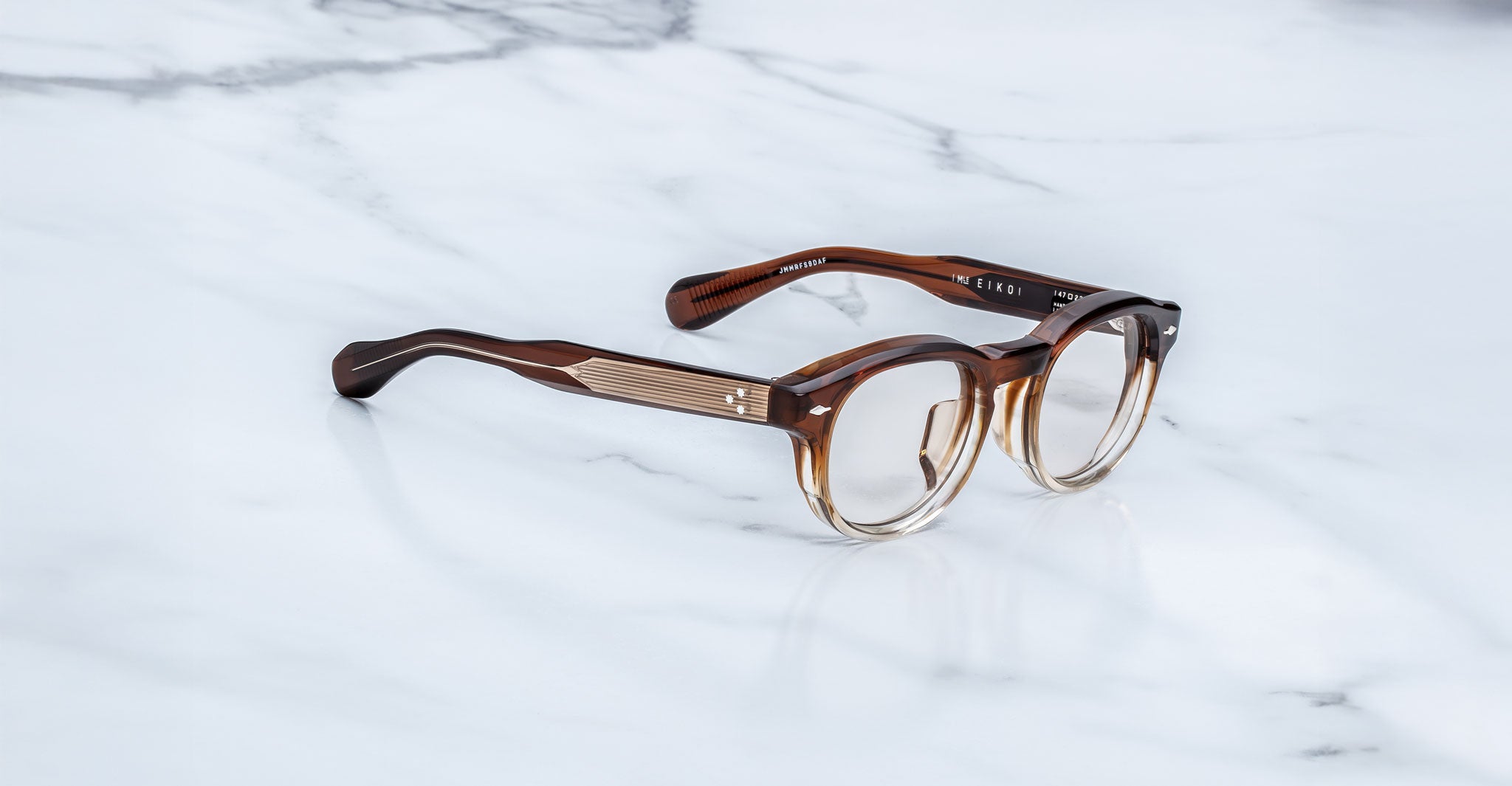 Jacques Marie Mage Eiko eyeglasses, round brown-gradient thick frames with clear lenses, front view, by Jacques Marie Mage.