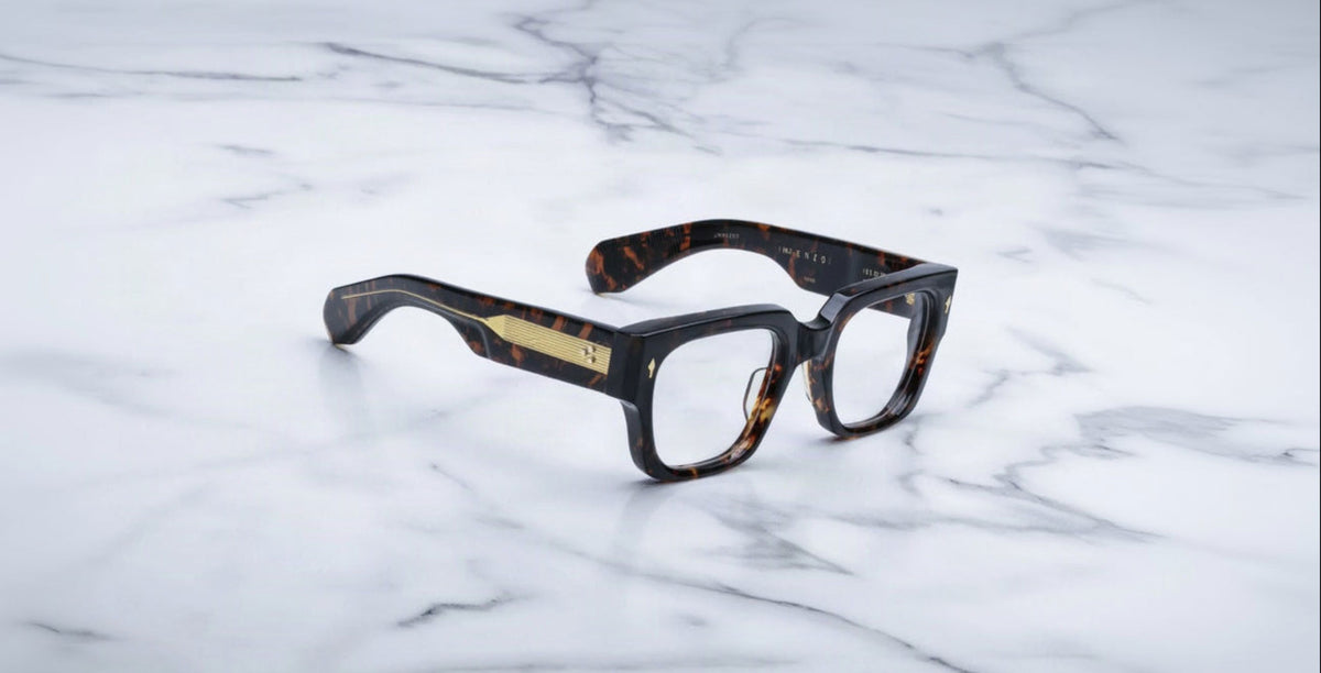 Jacques Marie Mage Enzo eyeglasses with gold-detailed arms, shown from above.