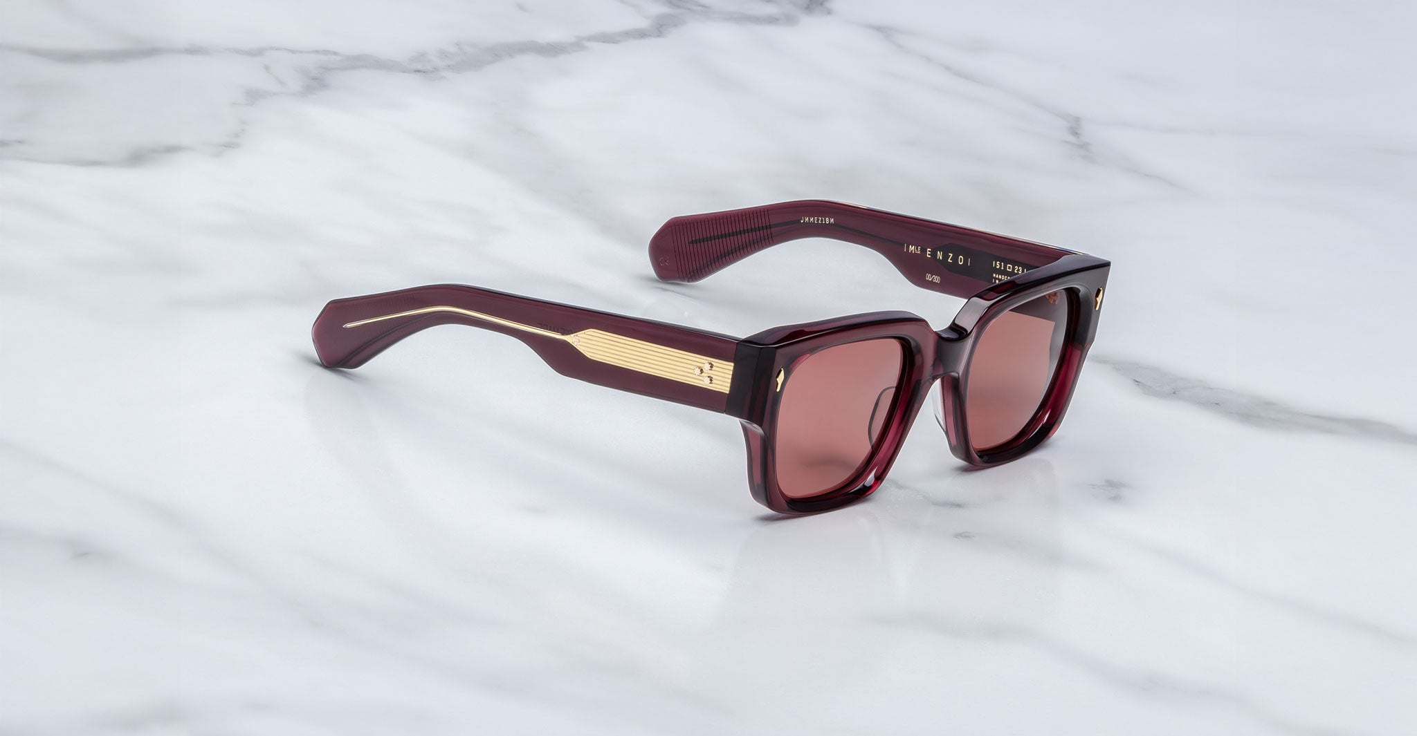 Jacques Marie Mage Enzo sunglasses, burgundy frames with gold accents, front view.