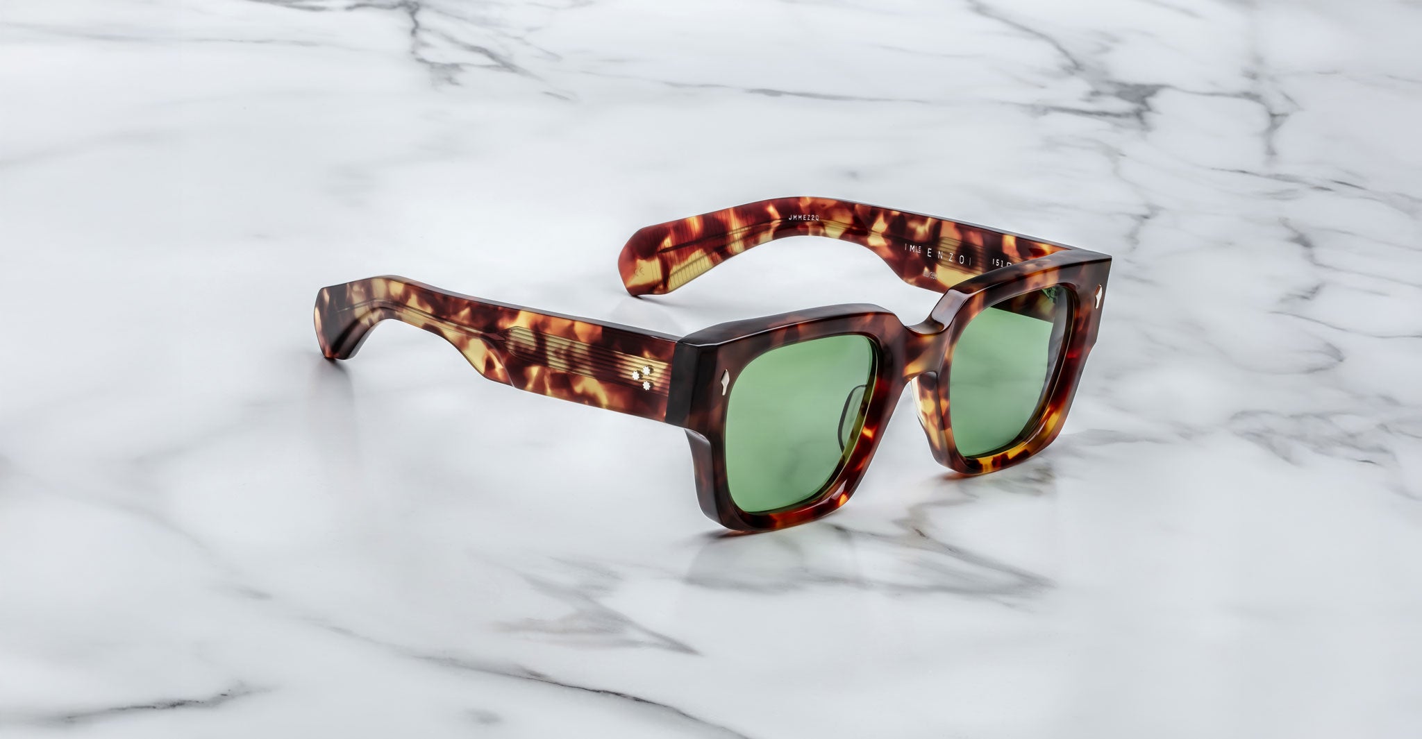 Jacques Marie Mage Enzo tortoiseshell sunglasses with green lenses, top view.