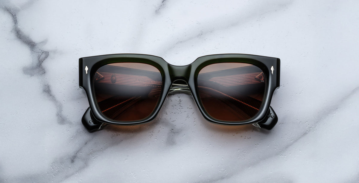 Jacques Marie Mage Enzo black square sunglasses with UV-protection dark lenses, viewed from above.