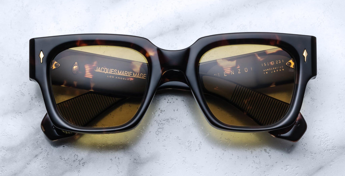 Jacques Marie Mage Enzo rectangular sunglasses with gold accents, top view, showcasing frame and temples.