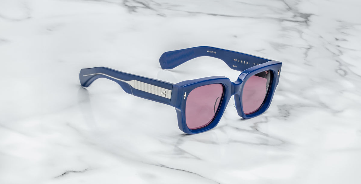 Jacques Marie Mage Enzo blue rectangular sunglasses with pink lenses and silver accents, front view.