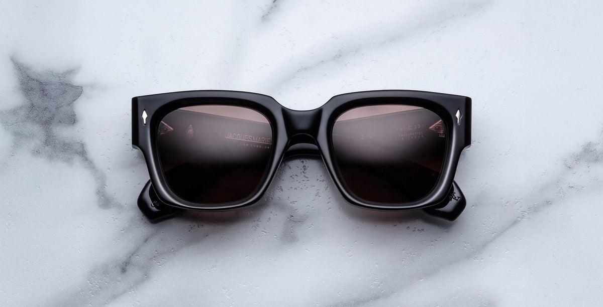Jacques Marie Mage Enzo black rectangular sunglasses with UV protection, top view.