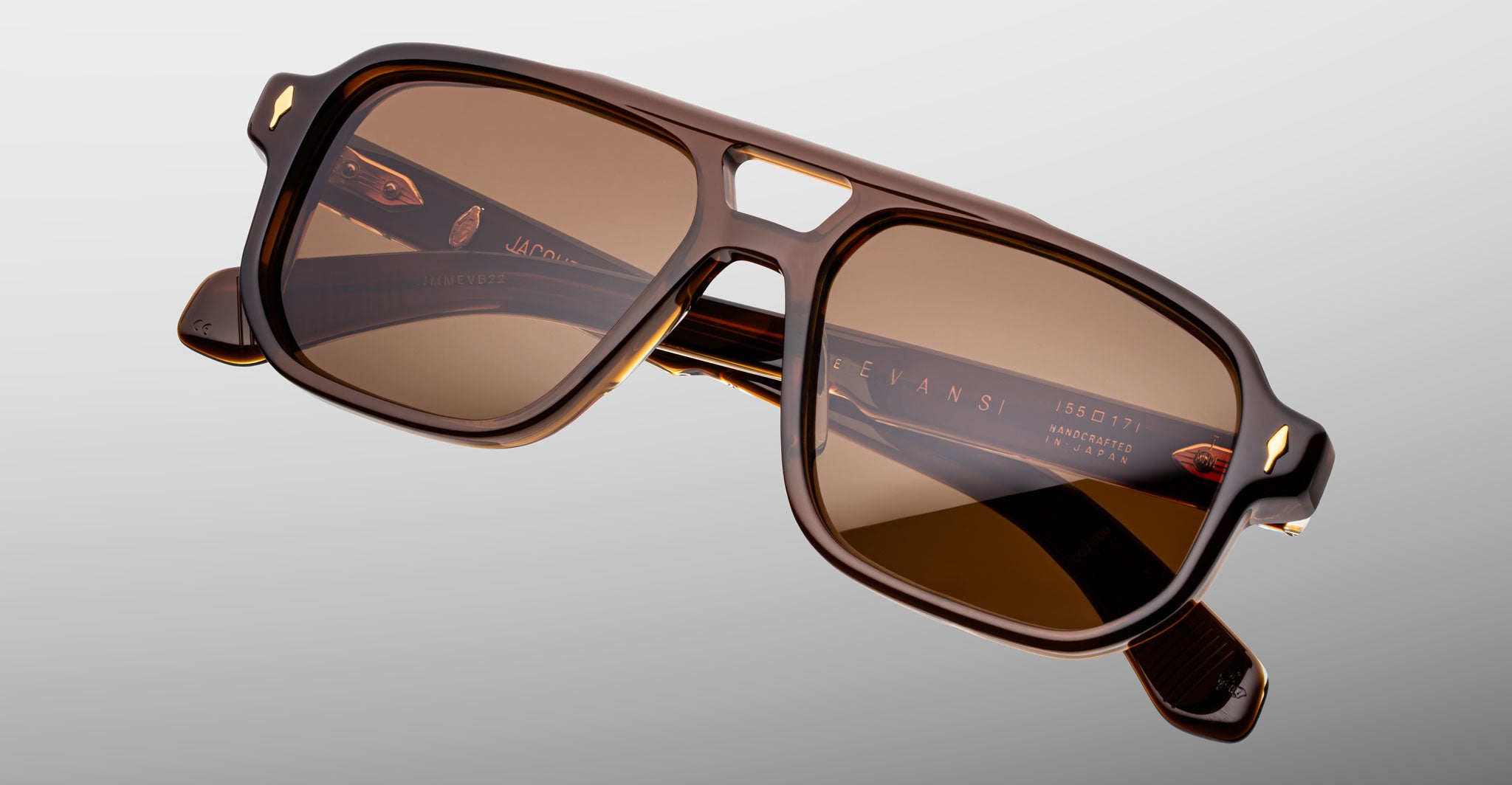 Jacques Marie Mage Evans sunglasses, brown rectangular frames, thick temples, brown lenses, notched nose bridge, front view.