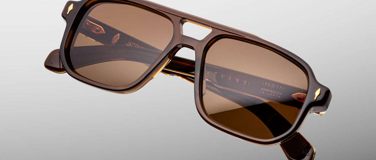 Jacques Marie Mage Evans sunglasses, brown rectangular frames, thick temples, brown lenses, notched nose bridge, front view.