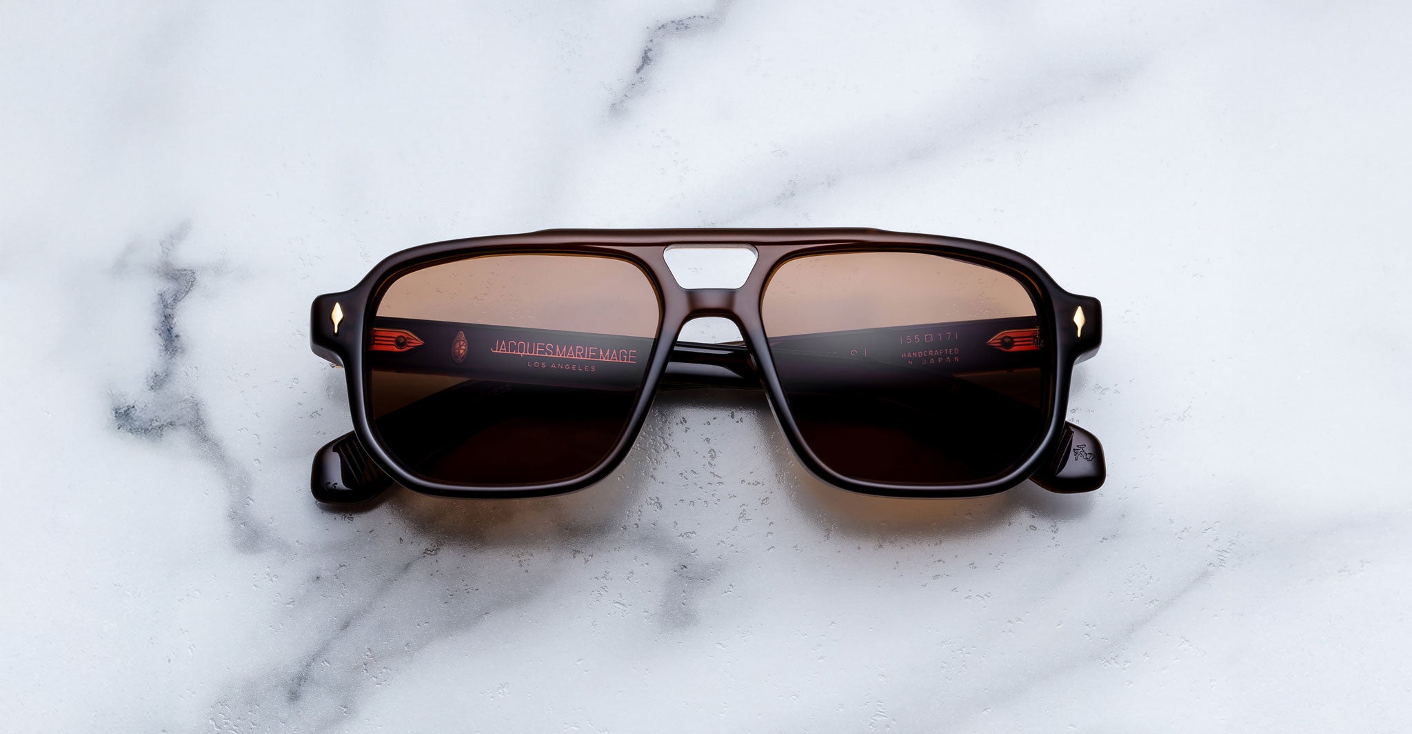 Jacques Marie Mage Evans black rectangular sunglasses with UV-protective lenses, shown from above.