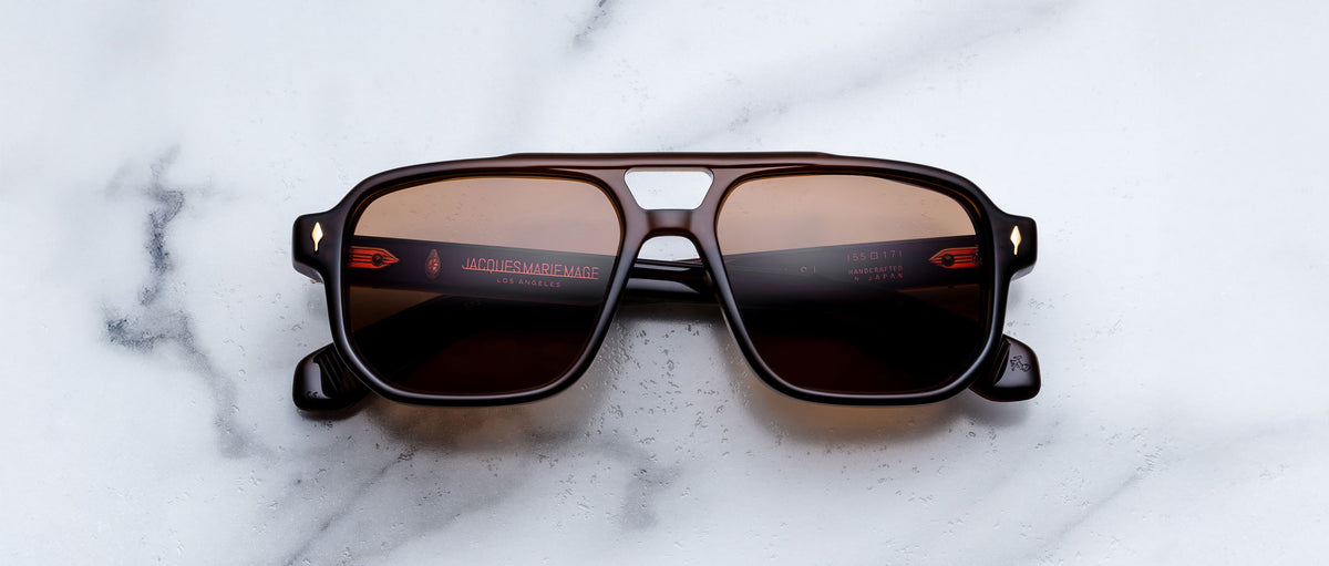 Jacques Marie Mage Evans black rectangular sunglasses with UV-protective lenses, shown from above.