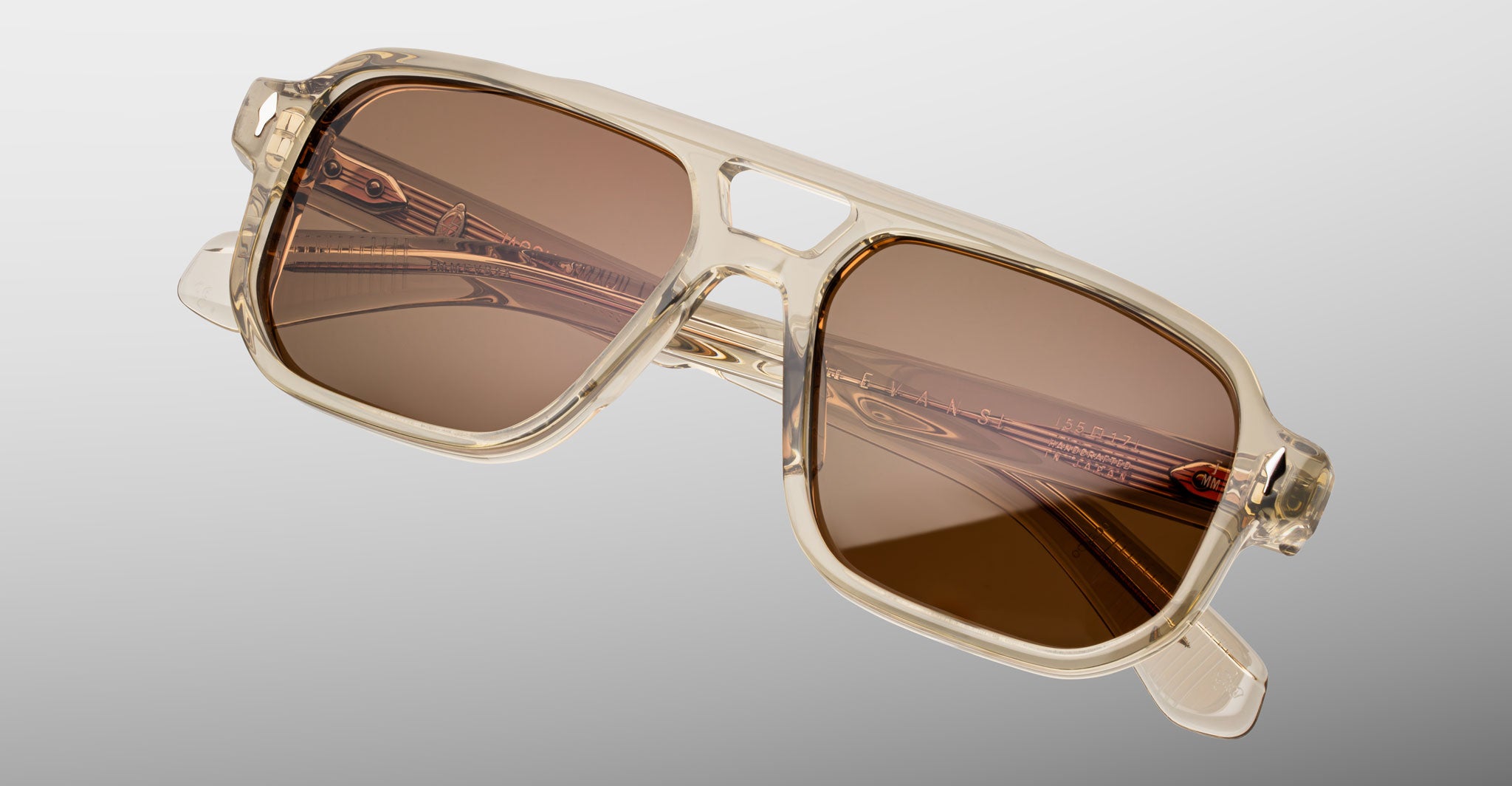 Jacques Marie Mage Evans sunglasses in translucent beige with brown lenses, shown at an angle.
