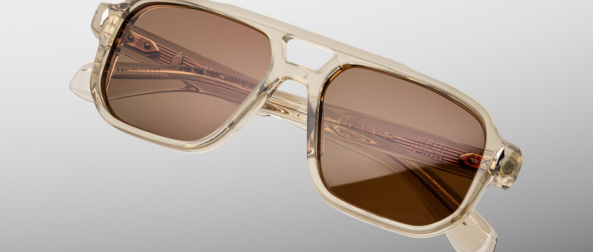 Jacques Marie Mage Evans sunglasses in translucent beige with brown lenses, shown at an angle.