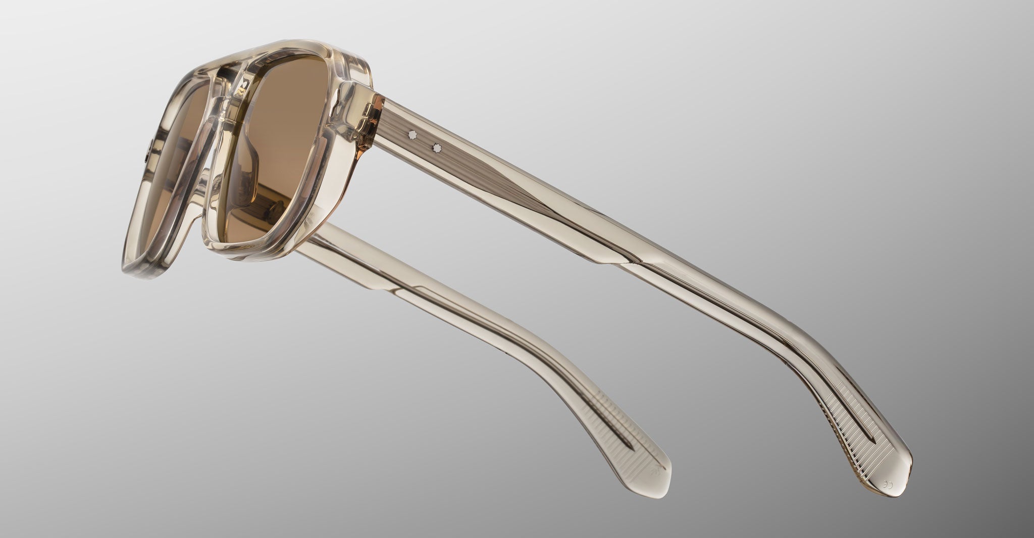 Jacques Marie Mage Evans sunglasses, transparent beige frame, brown lenses, side view.