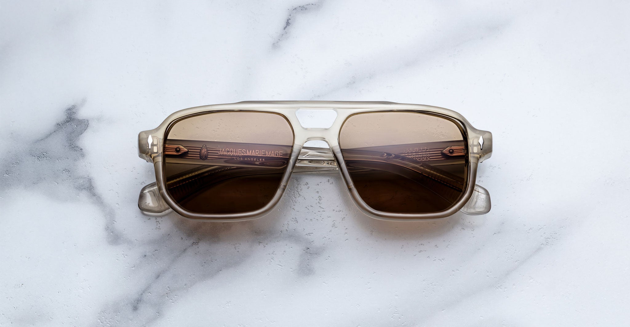 Jacques Marie Mage Evans sunglasses with brown lenses, viewed from above, display the full frame and lens shape.
