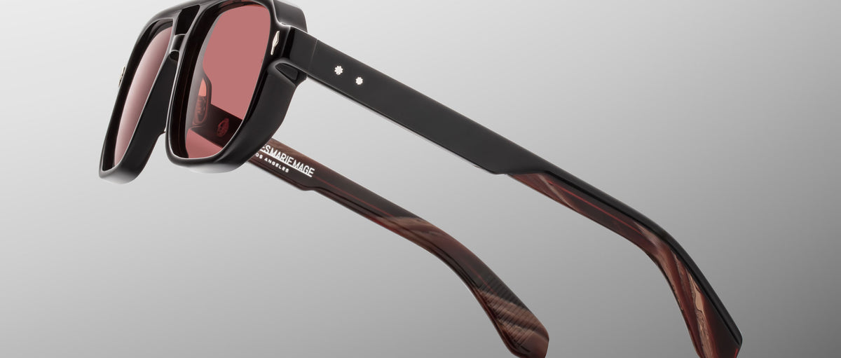 Jacques Marie Mage Evans sunglasses with black frames, red lenses, marbled brown arms, and red accents, front view.
