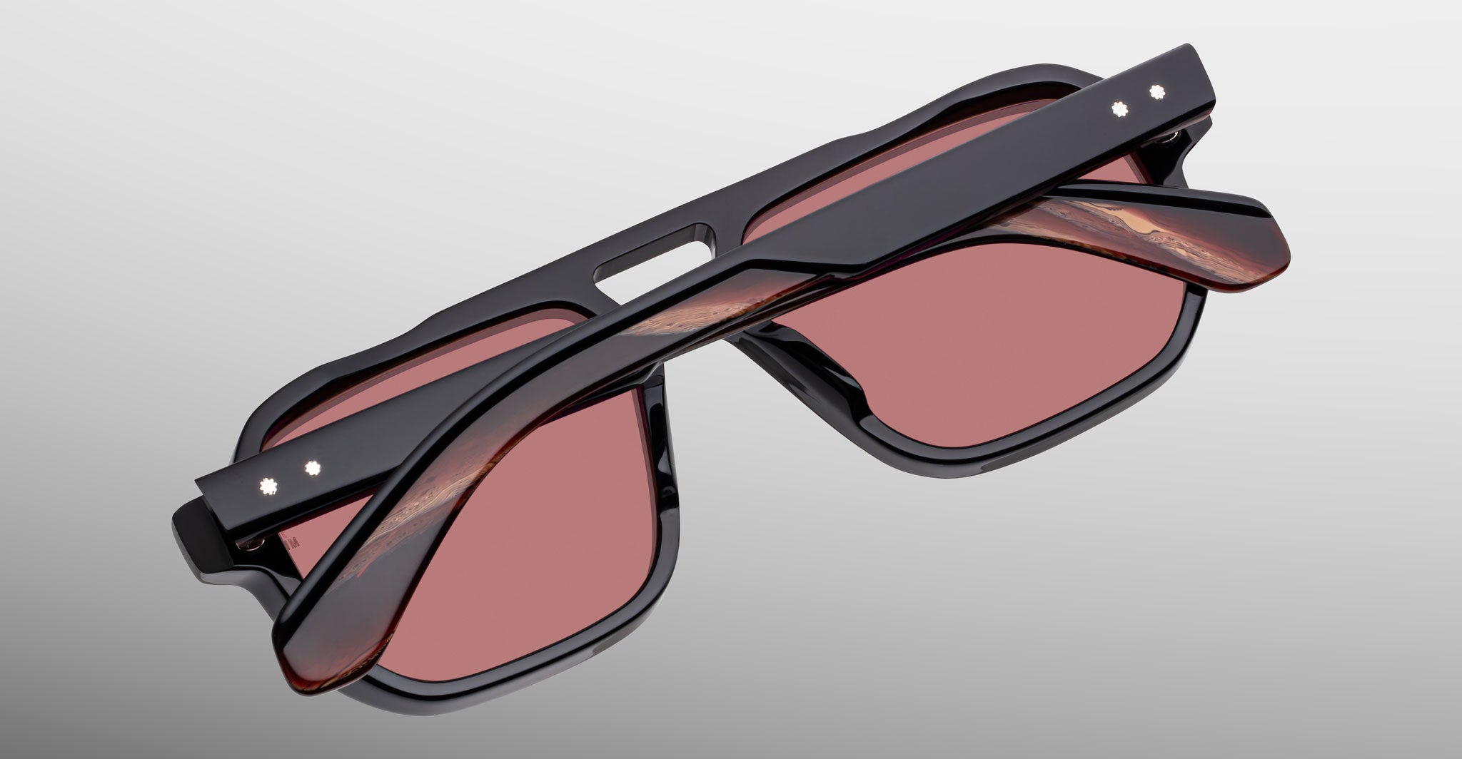 Jacques Marie Mage Evans sunglasses, red-tinted lenses, folded view, luxury eyewear.