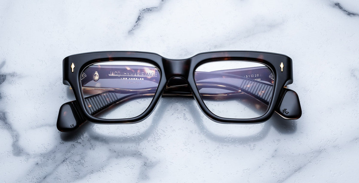 Jacques Marie Mage Fellini square tortoiseshell eyeglasses with folded arms viewed from above.