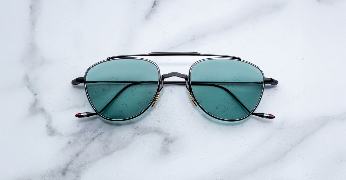 Jacques Marie Mage Flynn aviator sunglasses shown from above, displaying frame details and lens shape.