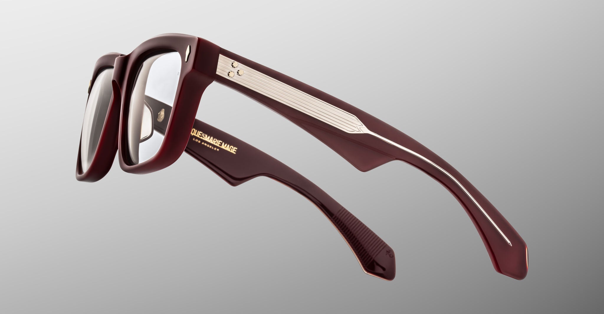 Jacques Marie Mage Hyannis in Bordeaux eyeglasses, dark red rectangular frame with silver temple accents, close-up side angle.